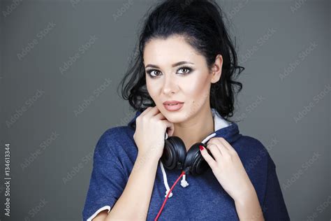 Portrait Beautiful Brunette Woman Posing With Headphones Stock Photo Adobe Stock