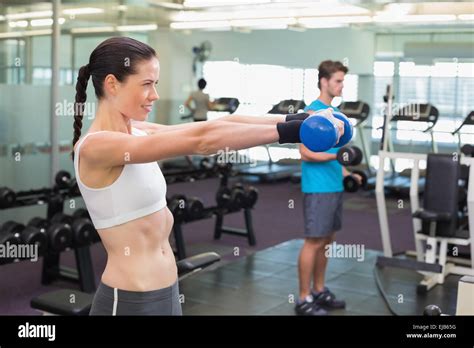 Fit Brunette Lifting Blue Dumbbell Stock Photo Alamy