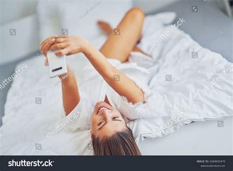 Brunette Sexy Girl On Bed Phone Stock Photo Shutterstock