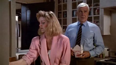 Leslie Nielsen And Priscilla Presley In A Kitchen Scene From The Naked Gun