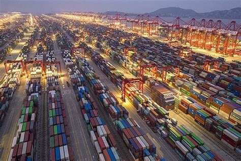 An Aerial View Of Shipping Containers At Night