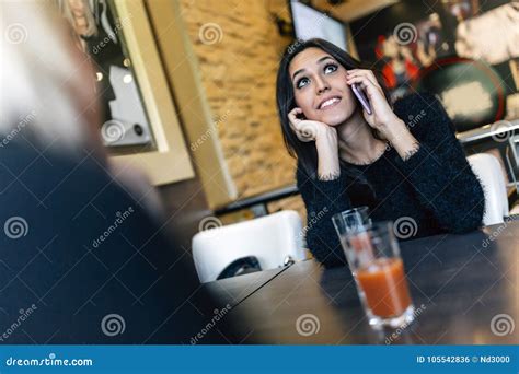 Beautiful Brunette Talking On Phone In Cafe Stock Photo Image Of