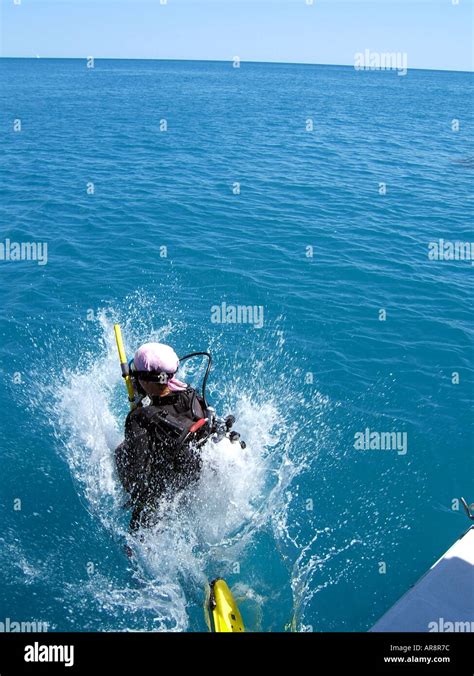 Scuba Diver Jumping Into The Water From A Dive Boatcoastal Waters