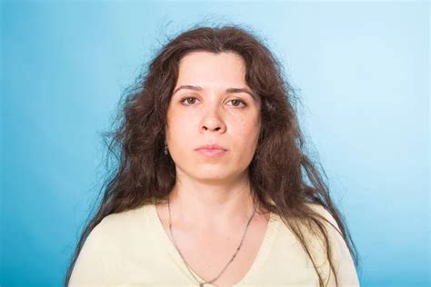 Portrait Of Sensual Nude Woman With Curly Hair On Blue Background Stock Photo Satura