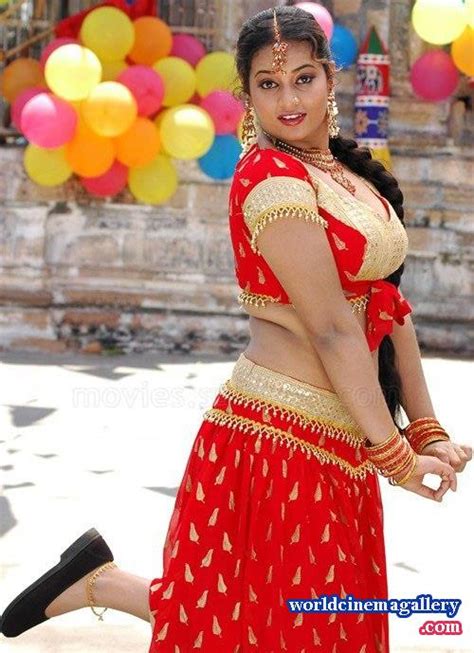 Suja Varunee Hot Stills In Orange Dress