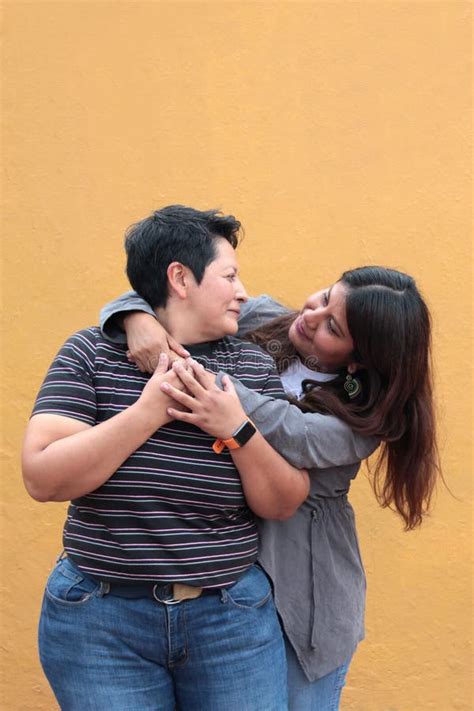 Married Latina Couple Cuddling Standing On The Beach Stock Photo Image Of Retired Elderly