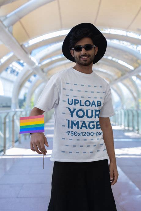 Placeit Blinkstore Tee Mockup Of A Bearded Man Holding A Rainbow Flag For Gay Pride Month
