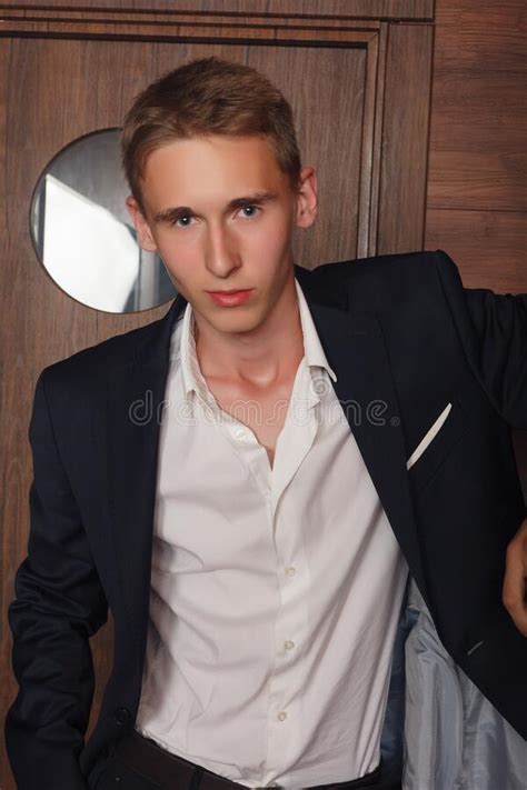 Portrait Of School Boy Dressing Formally In Black Suit Necktie Stock