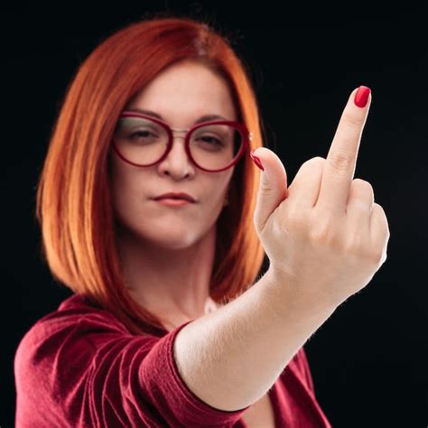 Premium Photo Confident And Angry Red Haired Woman Showing Finger Gesturing Fuck Off