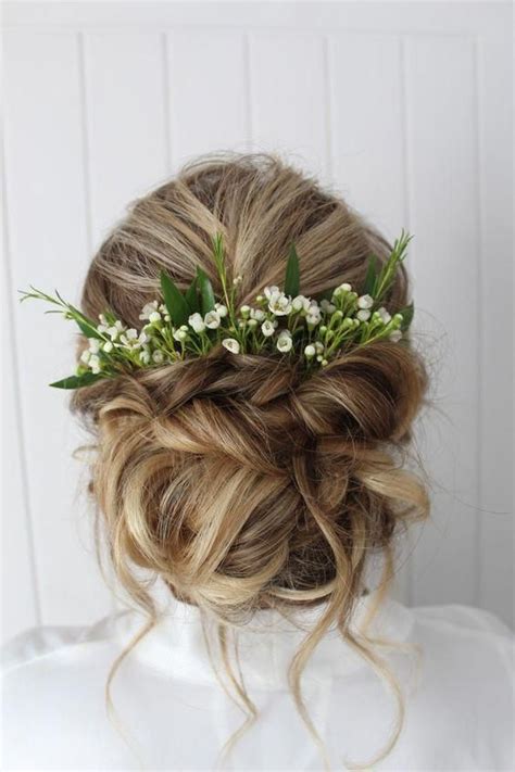 Wedding Hairstyle Updo With Greenery And Florals As Accessories