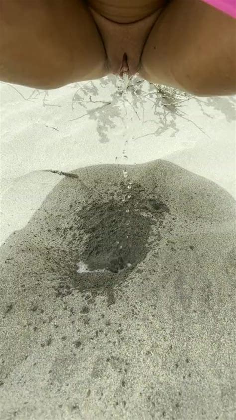 Cute Shaved Pussy Peeing In Sand ThisVid