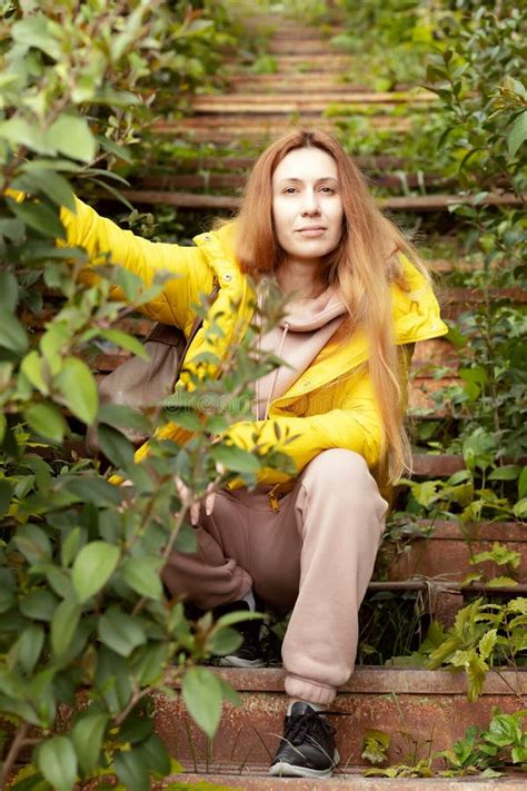 Blonde Girl In A Jacket Sits On Rusty Stairs Overgrown Old Rusty Stairs Stock Image Image Of