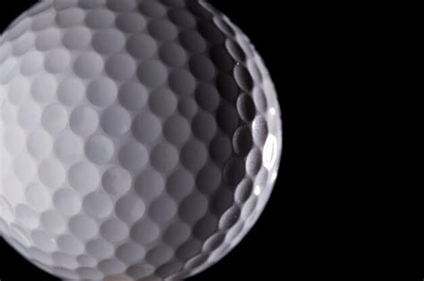 Premium Photo | Close-up of golf ball against black background