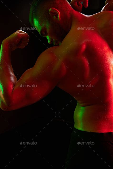 Man Professional Athletes With Naked Torso In Athletic Uniforms Isolated On A Multicolored