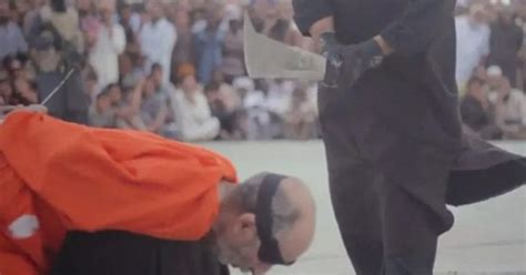 Sickening Footage Shows ISIS Executioners Beheading Two Men Accused Of