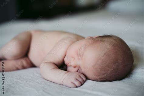 Cute Naked Baby On Bed Sleeping Stock Photo Adobe Stock