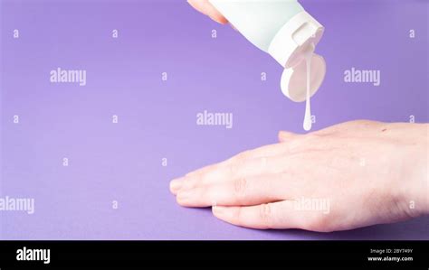 Moisturize hands with lotion. Woman applying moisturizing cream on ...