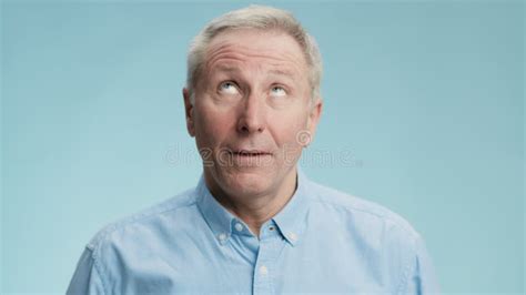 Close Up Portrait of Tedious Senior Man Rolling Up His Eyes and Grimacing, Feeling Uninspired ...