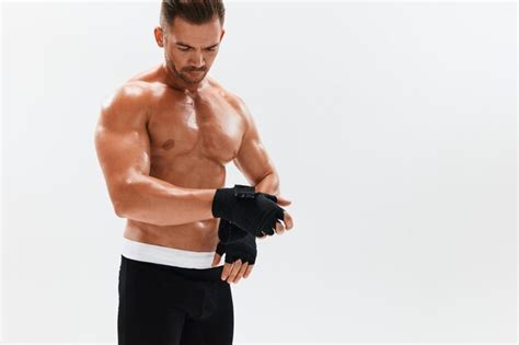 Premium Photo Man Athletic Bodybuilder Poses In Boxing Gloves With Nude Torso Abs In Full