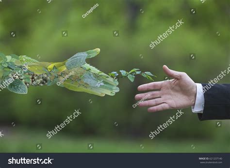 Hand Businessman Reach Out Towards Hand Stock Photo 621237140