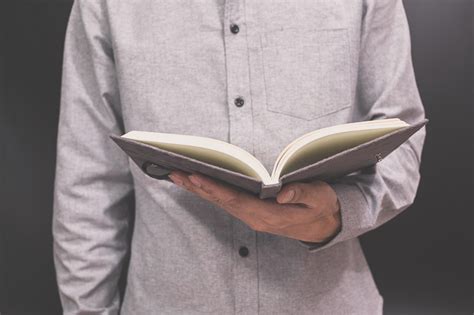 Person Holding Open Book Stock Photo At Vecteezy