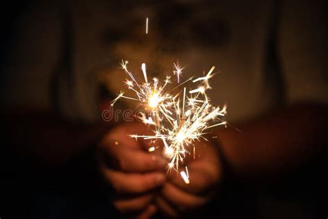 Hand Holding Sparkler Isolated On Black Background Stock Image Image