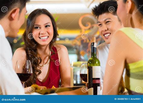 Chinese Business People Dining In Elegant Restaurant Stock Image