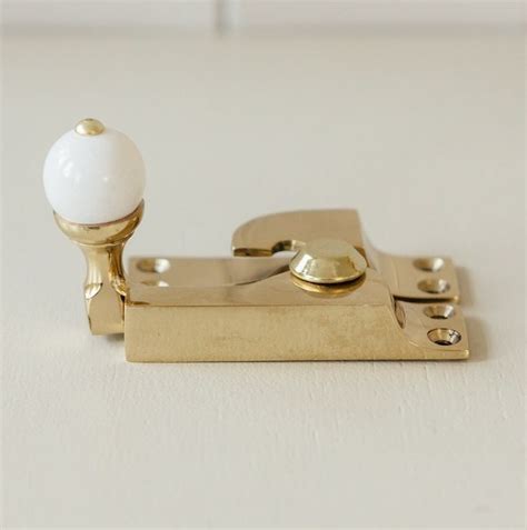 Straight Arm Sash Fastener With White Knob Brass For Sash Windows