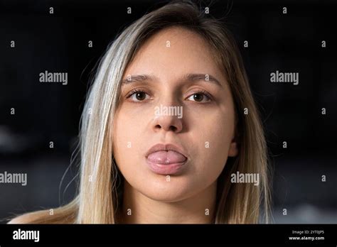 Attractive Positive Woman Blonde Grimaces Smiles Attracts Attention Looks In Mirror Shows