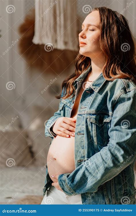 A Beautiful Pregnant Woman In A Denim Jacket With A Naked Tummy Stock Image Image Of Love