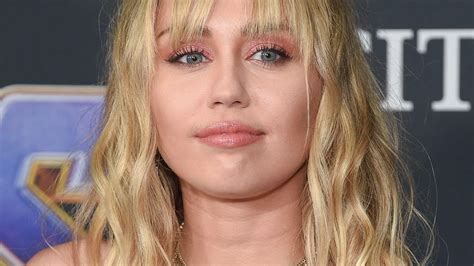 Miley Cyrus In Bikini Relaxes On Her Couch