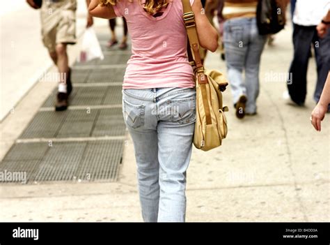 A Woman Walks Down The Street In Manhattan In Faded Jeans Nice Ass