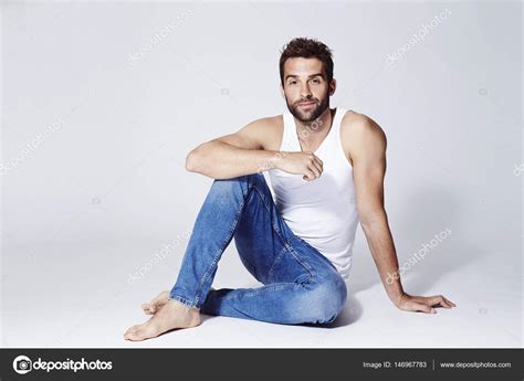 Bearded Man In Vest And Jeans Stock Photo Sanneberg