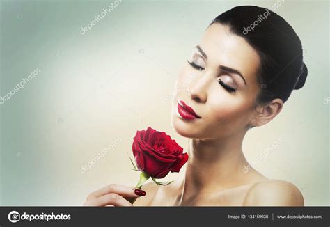 Romantic Woman Holding Red Rose On Light Background Stock Photo