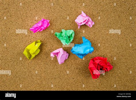 Colorful Crumpled Papers Over Cork Background Stock Photo Alamy