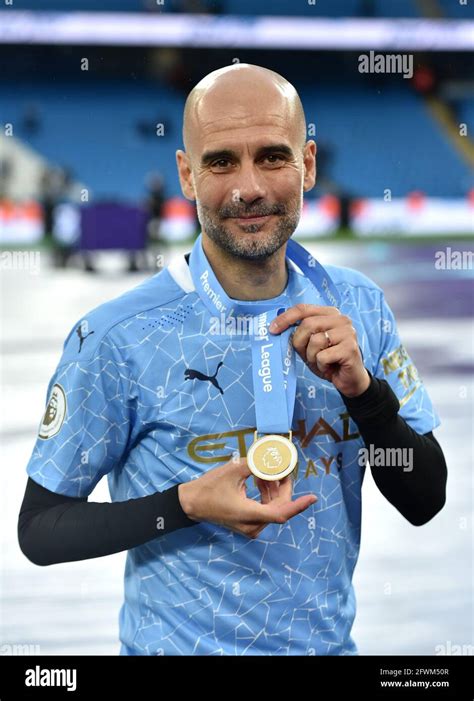 Manchester City Manager Pep Guardiola Poses With His Winners Medal