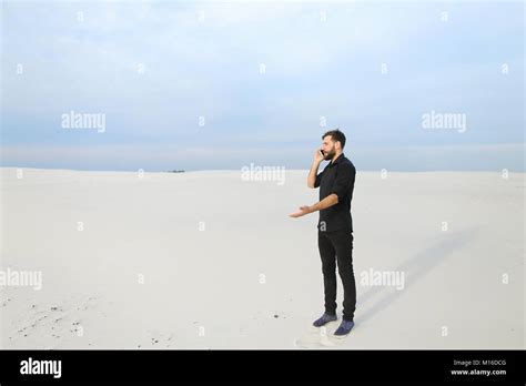 Amateur Photographer Guy Speaking On Smartphone At Seaside Stock Photo Alamy