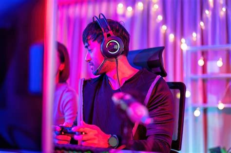 Premium Photo | At home game player wearing headset have fun play ...