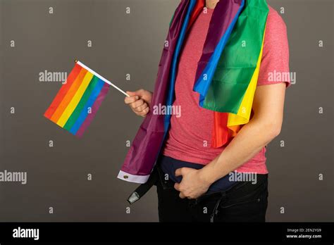 Gay Man Wearing Pink T Shirt And A Rainbow Flag Stock Photo Alamy