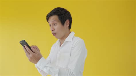 Asian handsome man exited surprise face expression . Male feels shocked