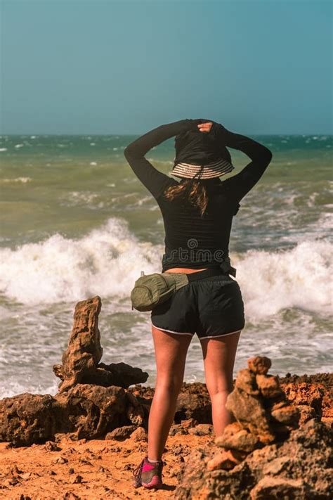 Coastal Escape Woman In Awe Of The Ocean On A Sunny Day In La Guajira