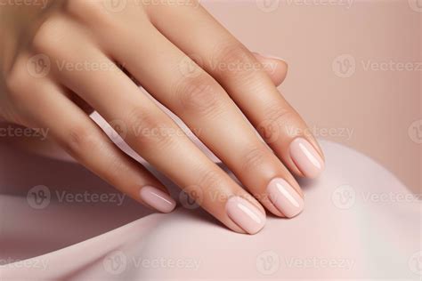 Glamour Woman Hand With Nude Nail Polish On Her Fingernails Nude Shade Nail Manicure With Gel