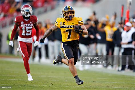 Cody Schrader Of The Missouri Tigers Runs The Ball In The First Half