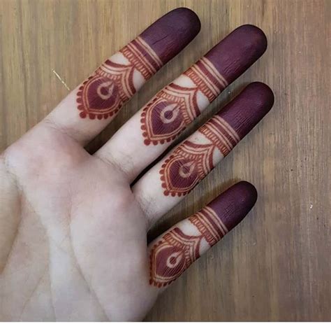 A Person S Hand With Henna Tattoos On It