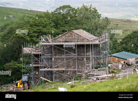 Barn In The Yorkshire Dales National Park With Scaffolding Around It