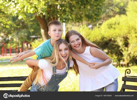 Lesbian Mothers With Foster Son Stock Photo Belchonock