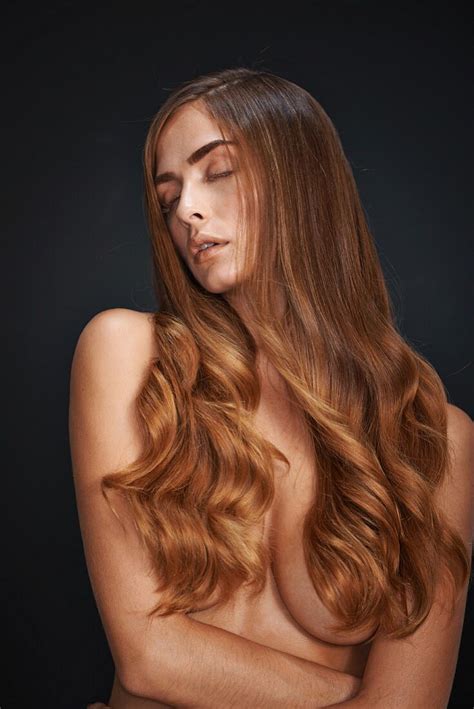 A Naked Woman With Long Curly Hair License Image Image Professionals