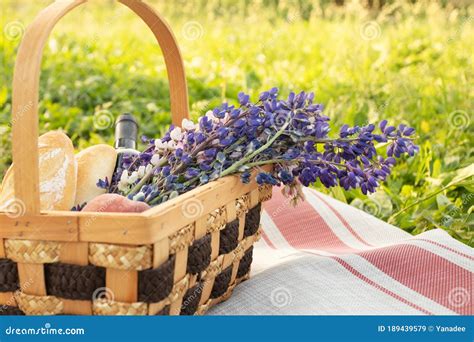 Romantic Picnic For A Couple Basket With Flowers Wine Peaches And