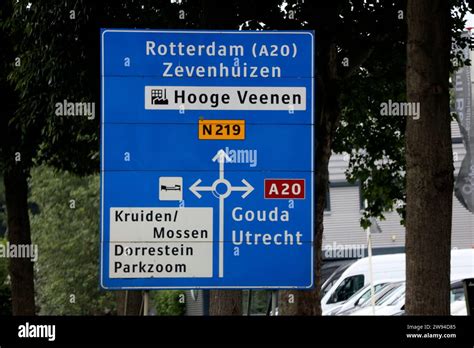 Blue Direction Signs On Regional Road N219 At Junction To A20 Motorway