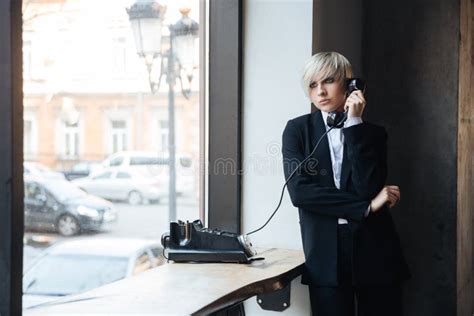 Pretty Blonde Girl Sitting On The Couch In A Hat Stock Photo Image Of Glass Blonde